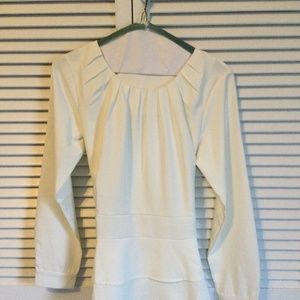 Cream colored blouse in a size medium